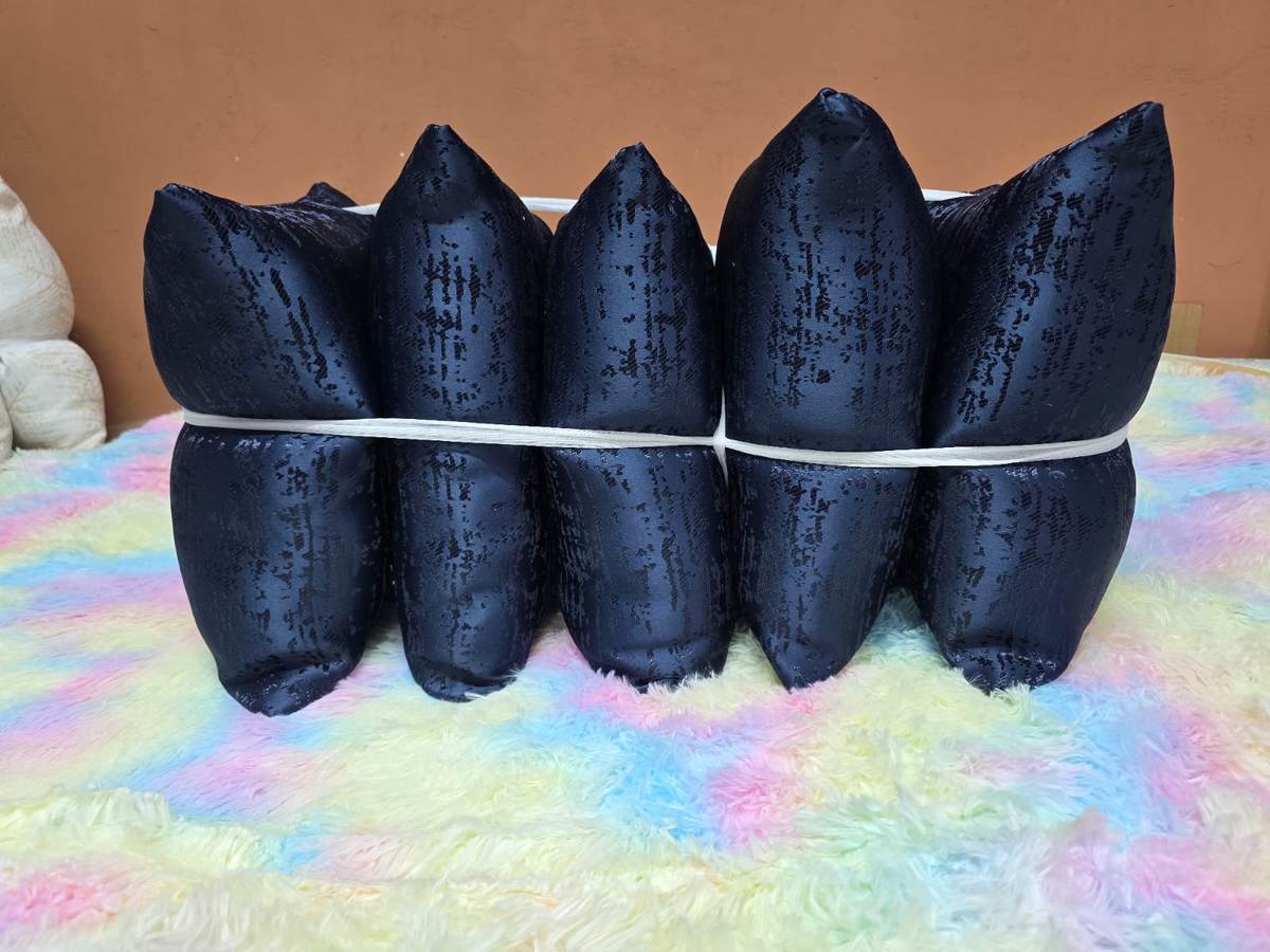 A Set of 5 Fiber Throw Pillows